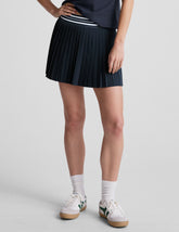 blue mini length pleated skirt with an exposed stripped elastic waistband and 
internal performance shorts with pockets.